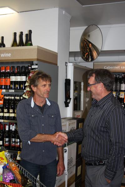 Constellation CEO Joe Stanton congratulates lucky grocery winner Ray Hunter